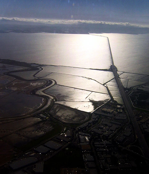 Several miles of bridge connect the west and east shores of the Bay -- just south of both the Oakland and San Francisco airports.